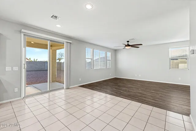 a kitchen with stainless steel appliances kitchen island granite countertop a stove a refrigerator and a microwave