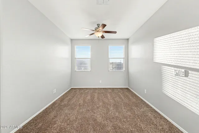a spacious bathroom with a double vanity sink a mirror and a shower