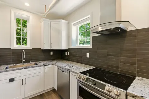 a view of a kitchen cabinets and wooden floor