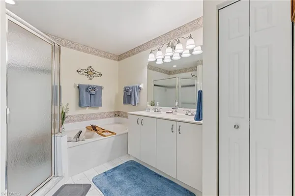 a bed room with a bed and a chair