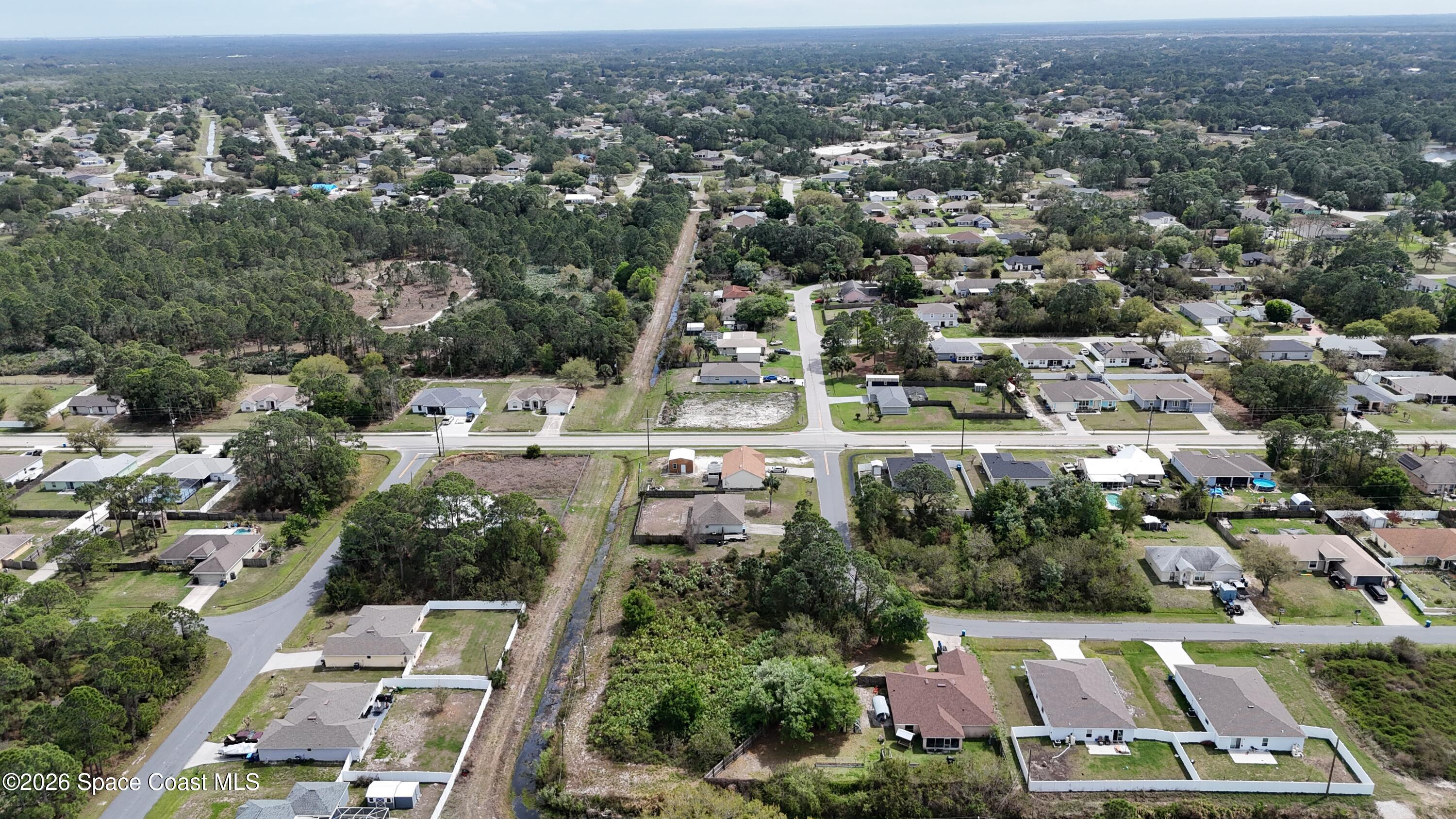 1805 Raintree Avenue Southeast Palm Bay, FL 32909 - Photo 11 of 14 an aerial view of residential houses with city view