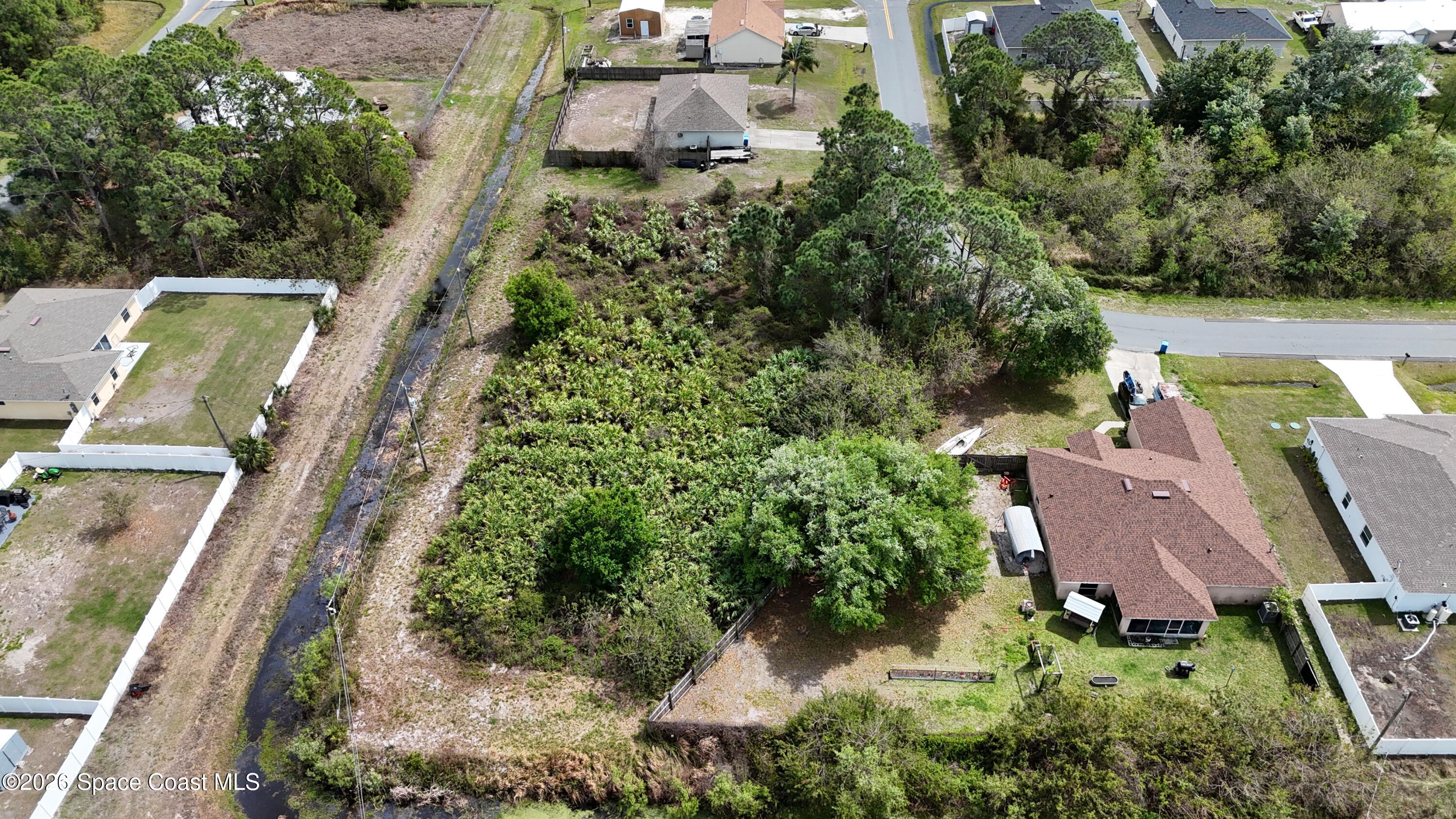 1805 Raintree Avenue Southeast Palm Bay, FL 32909 - Photo 12 of 14 an aerial view of a house with outdoor space and street view