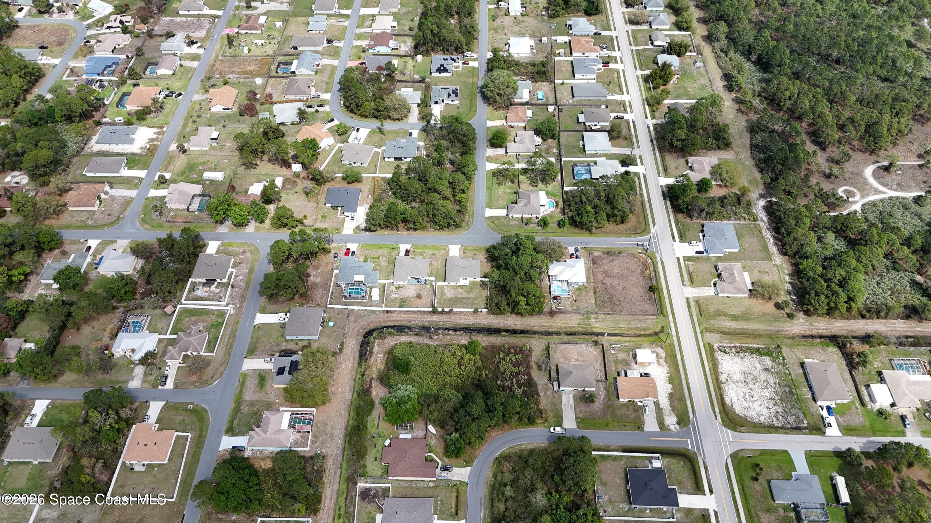 1805 Raintree Avenue Southeast Palm Bay, FL 32909 - Photo 8 of 14 an aerial view of multiple house