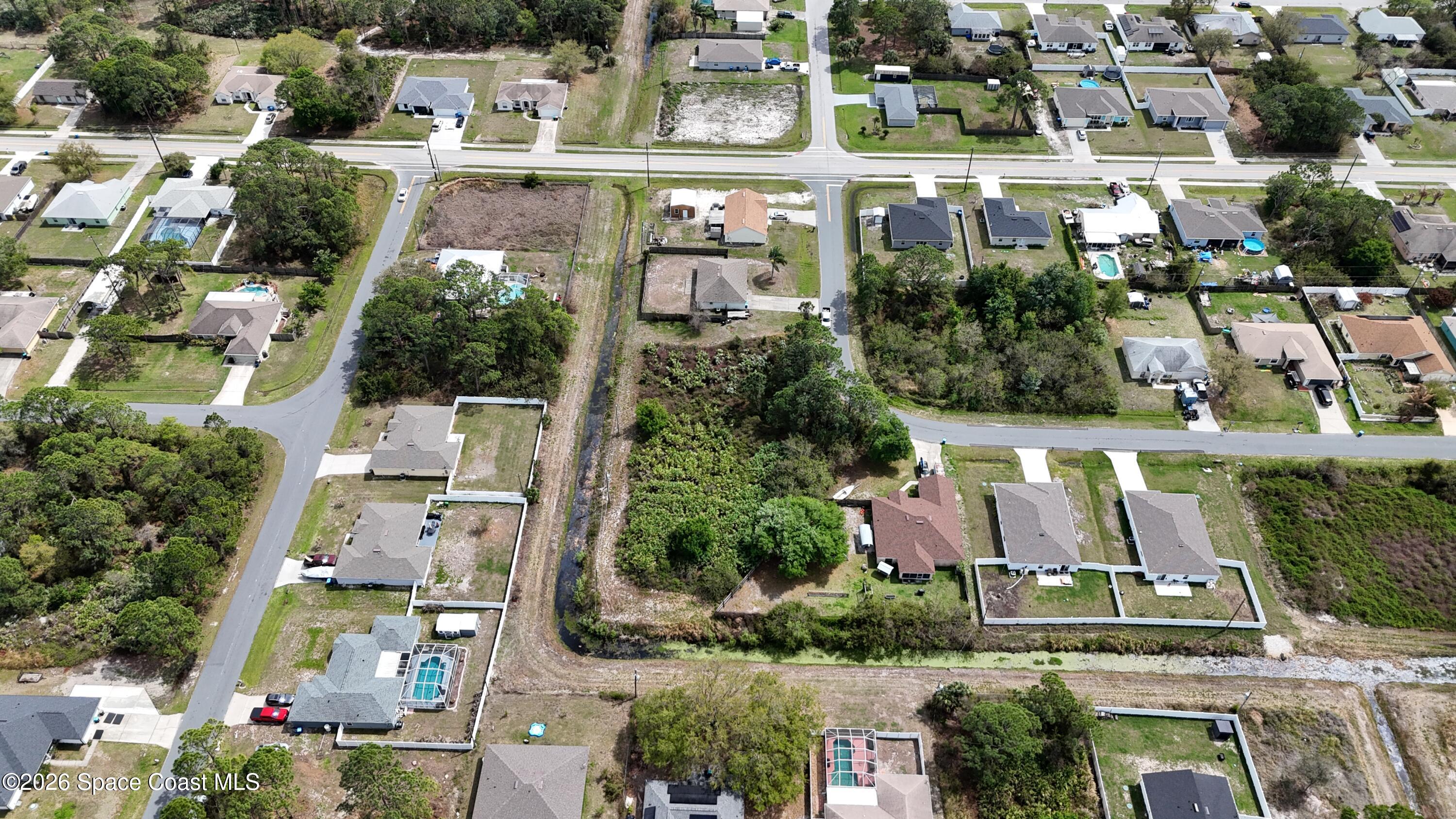 1805 Raintree Avenue Southeast Palm Bay, FL 32909 - Photo 10 of 14 an aerial view of multiple houses