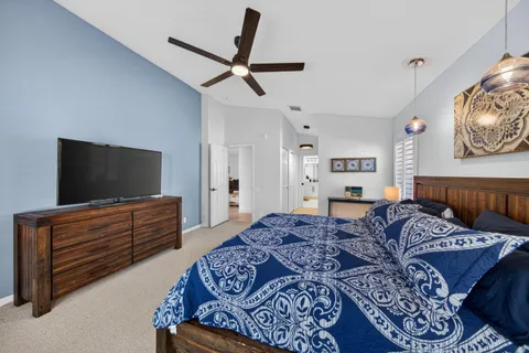 a living room with a bed and furniture