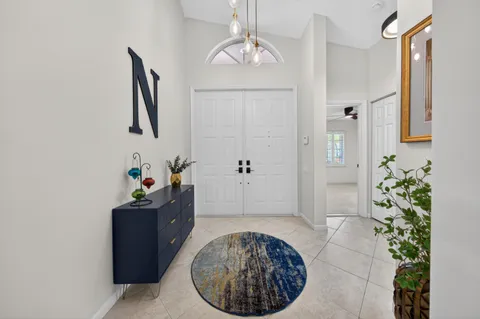 a view of a hallway with paintings on the walls