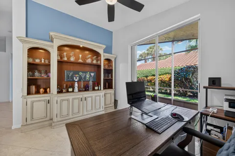 a workspace with pool table and a window