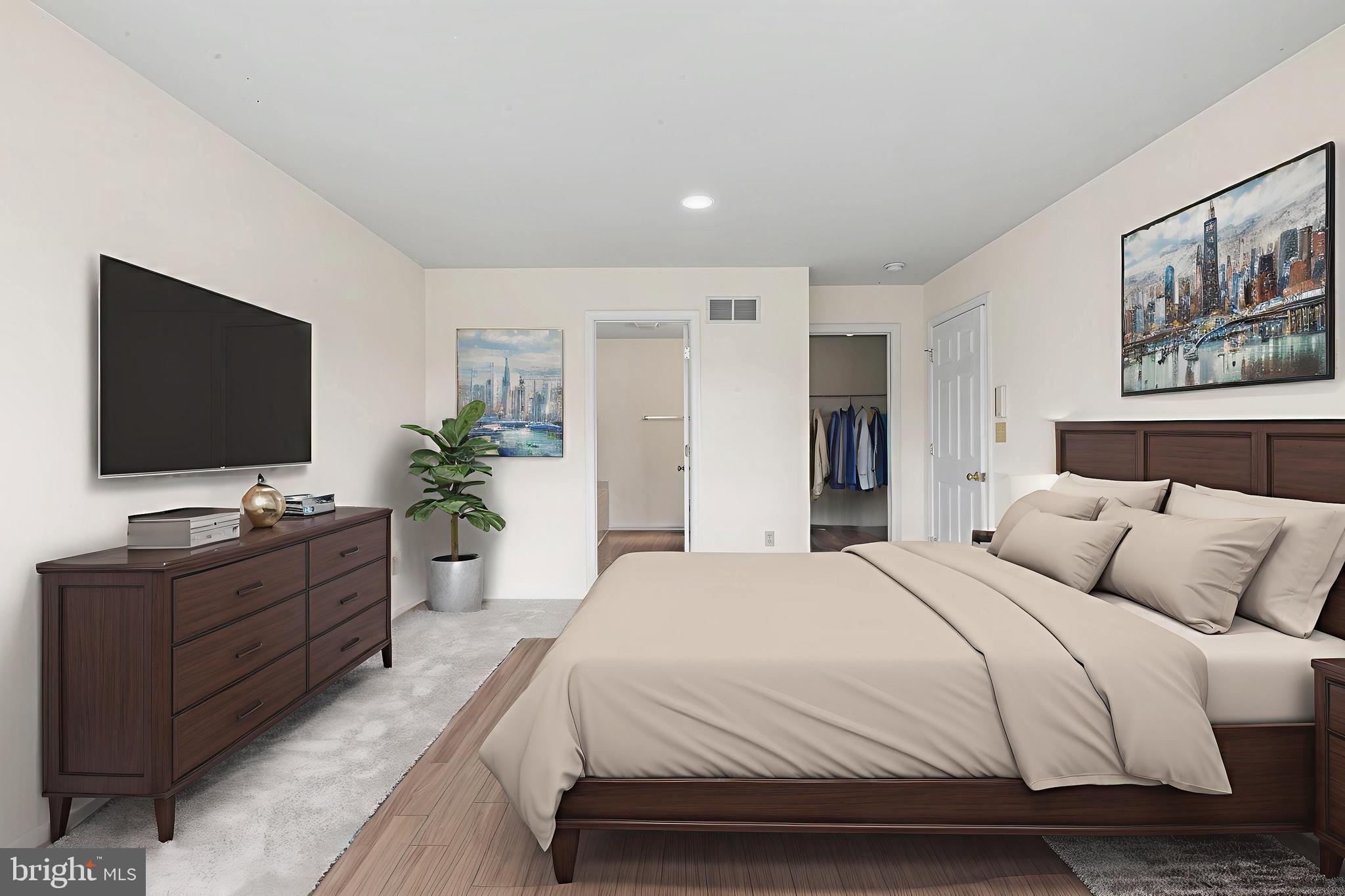 2004 Drake Run Royersford, PA 19468 - Photo 19 of 38 a spacious bedroom with a large bed and a flat screen tv