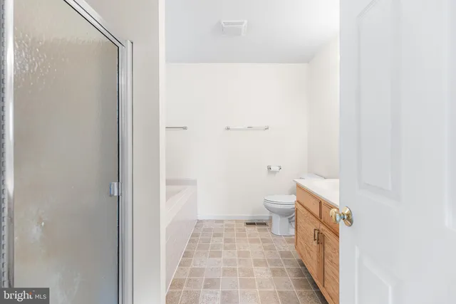 a bathroom with a bath tub and a shower
