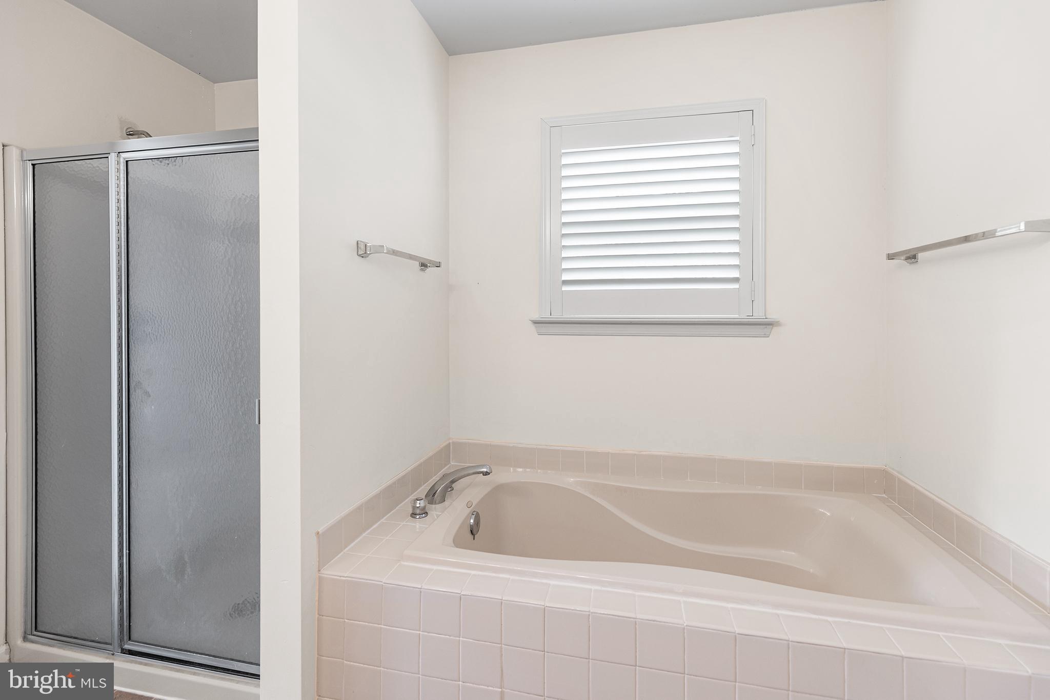 2004 Drake Run Royersford, PA 19468 - Photo 23 of 38 a bathroom with a bath tub and a shower
