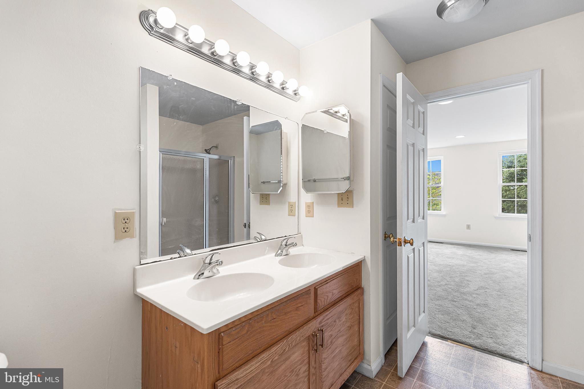 2004 Drake Run Royersford, PA 19468 - Photo 27 of 38 a bathroom with a sink a mirror and a shower
