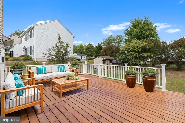 a view of a chairs and tables on the roof deck