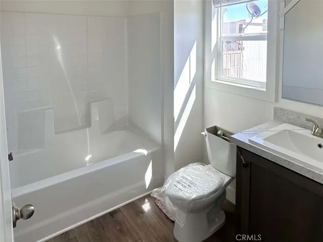 a bathroom with a sink a toilet and a bathtub