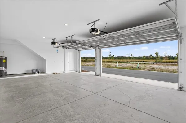 a view of a room with a stove and cabinets