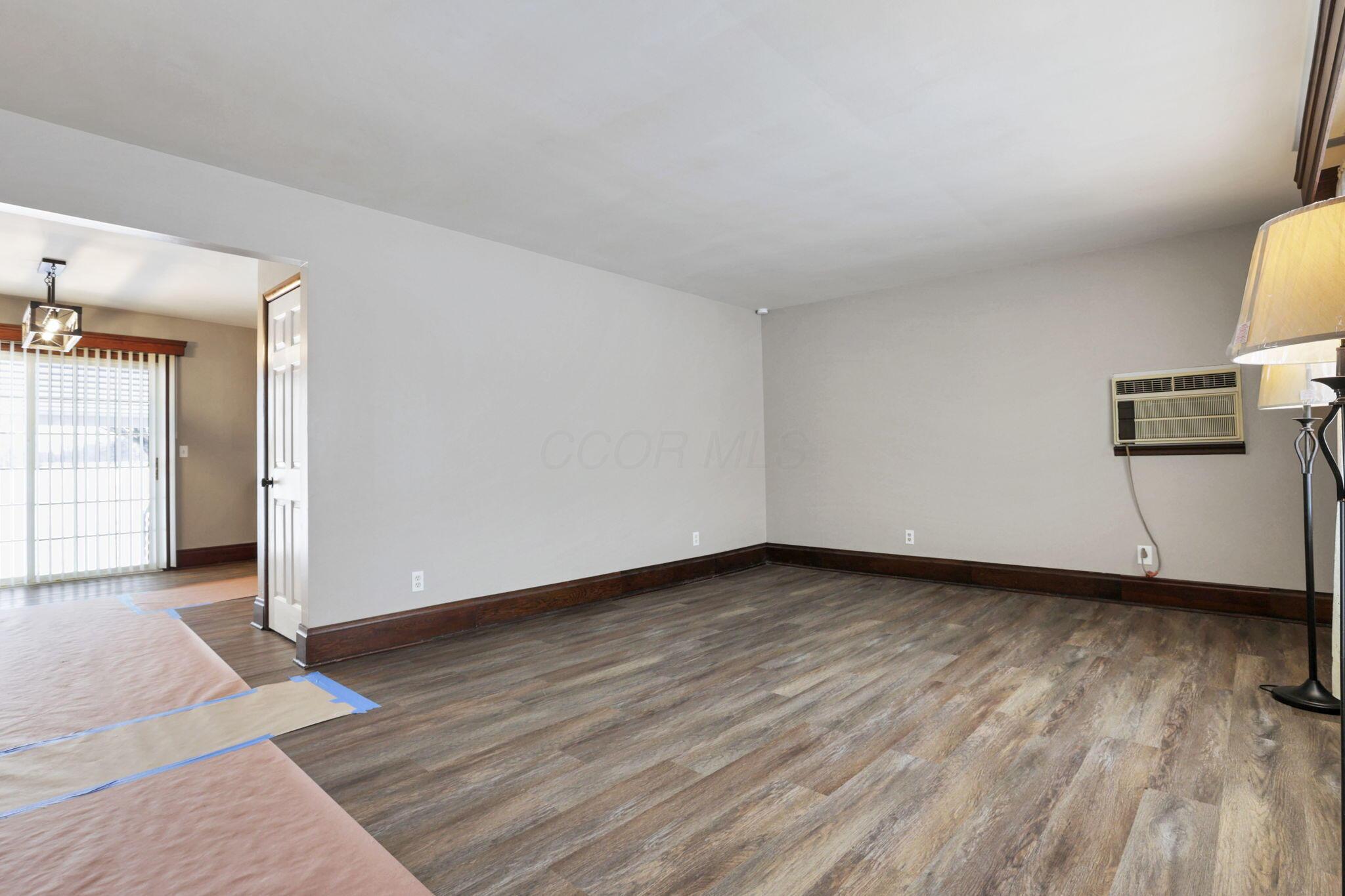 7974 Braun Road Groveport, OH 43125 - Photo 8 of 29 Spacious room featuring wood-finish flooring and a neutral color palette