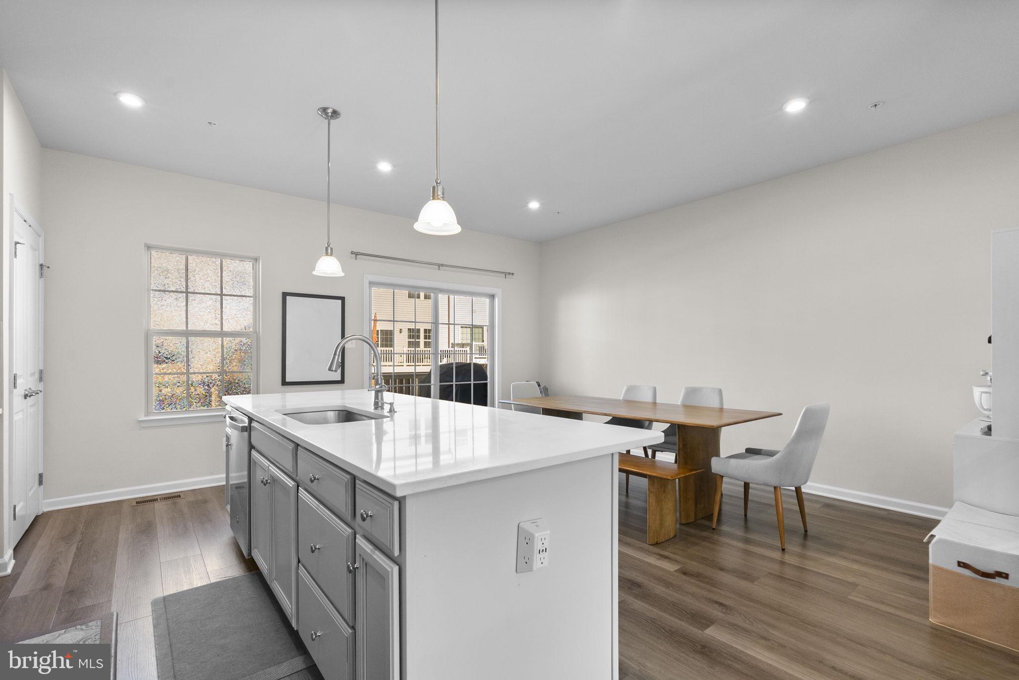 7911 Mine Run Road Hanover, MD 21076 - Photo 16 of 49 a large kitchen with a table and chairs