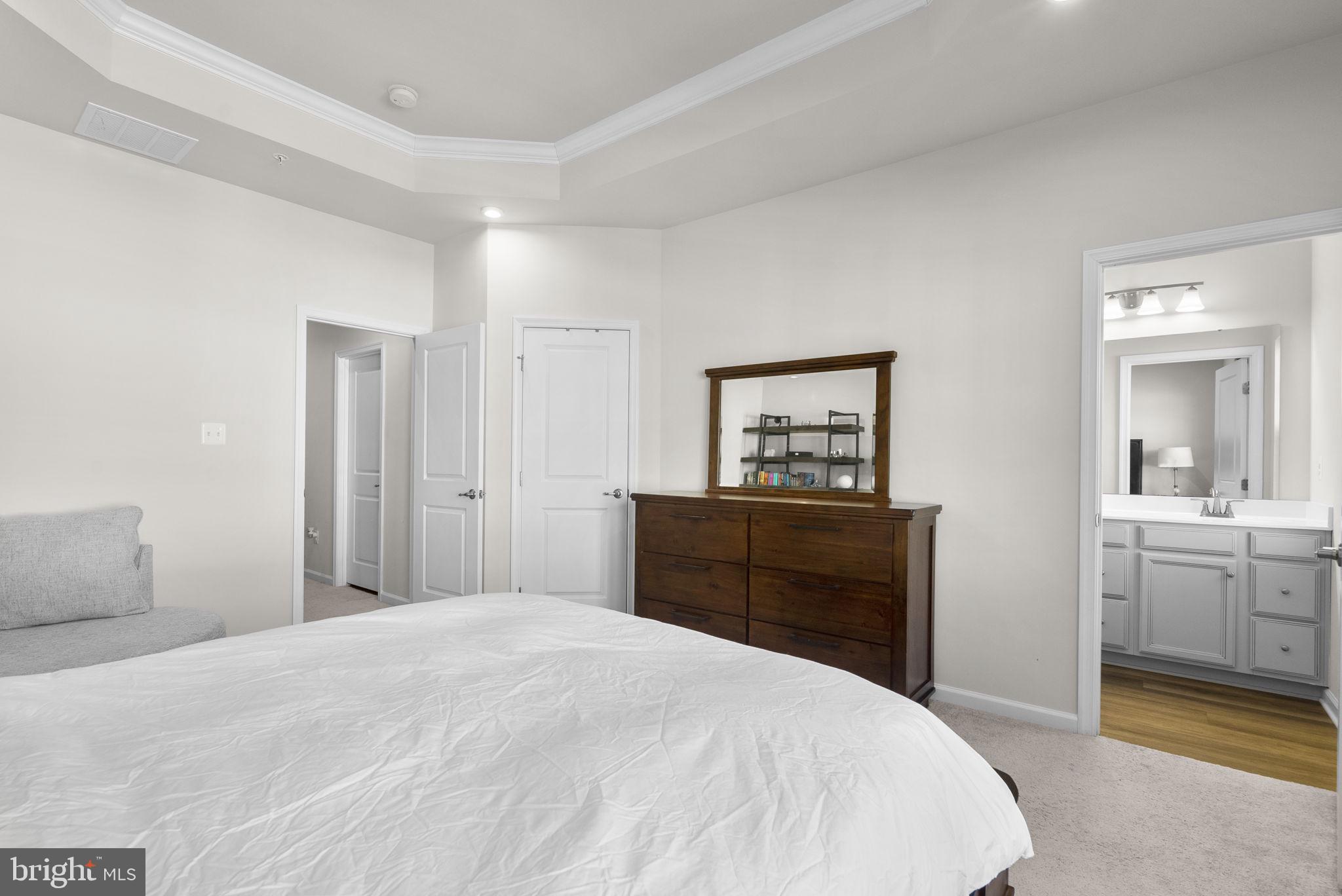 7911 Mine Run Road Hanover, MD 21076 - Photo 20 of 49 a bedroom with a bed and a dresser