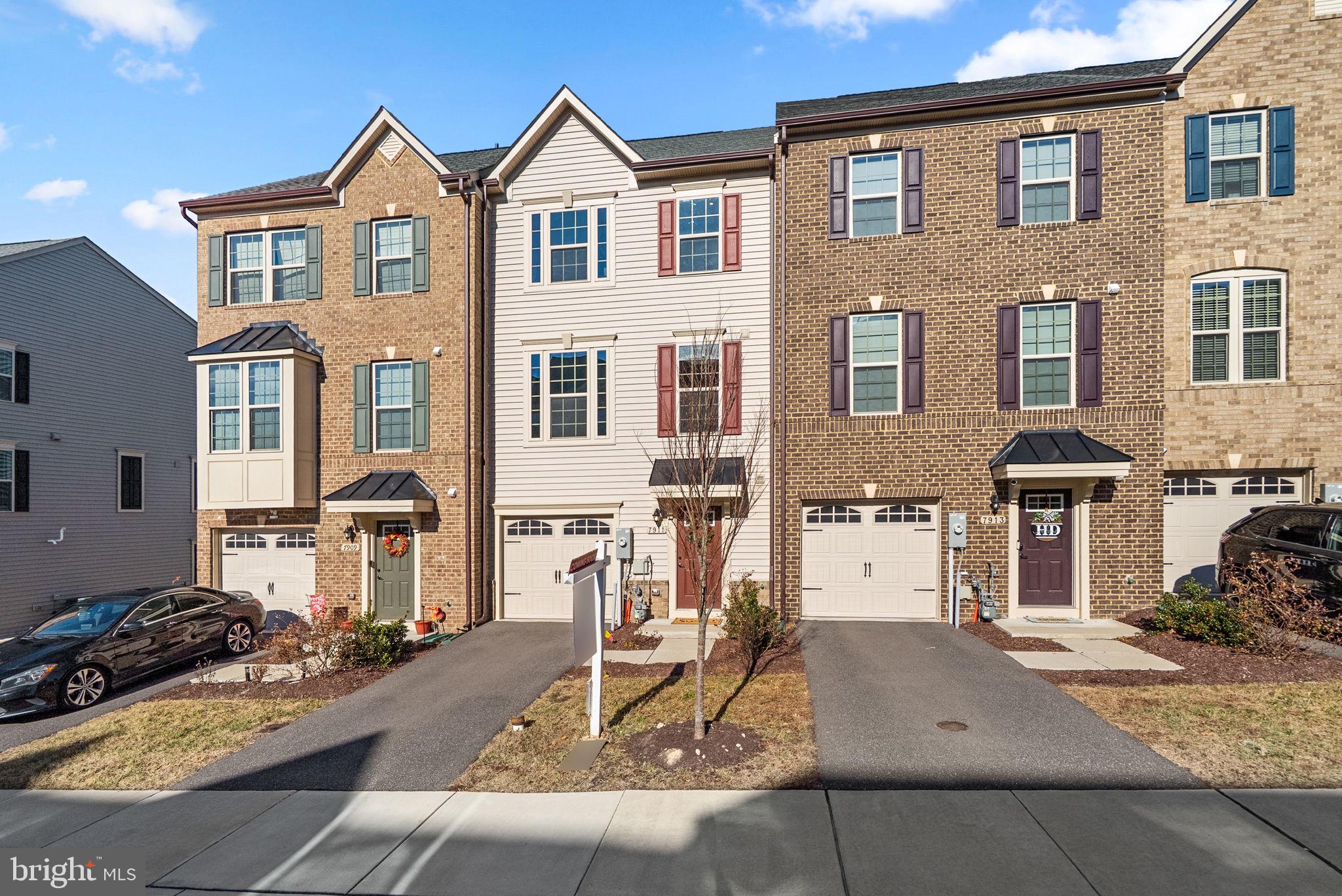 7911 Mine Run Road Hanover, MD 21076 - Photo 2 of 49 a front view of a house with a yard