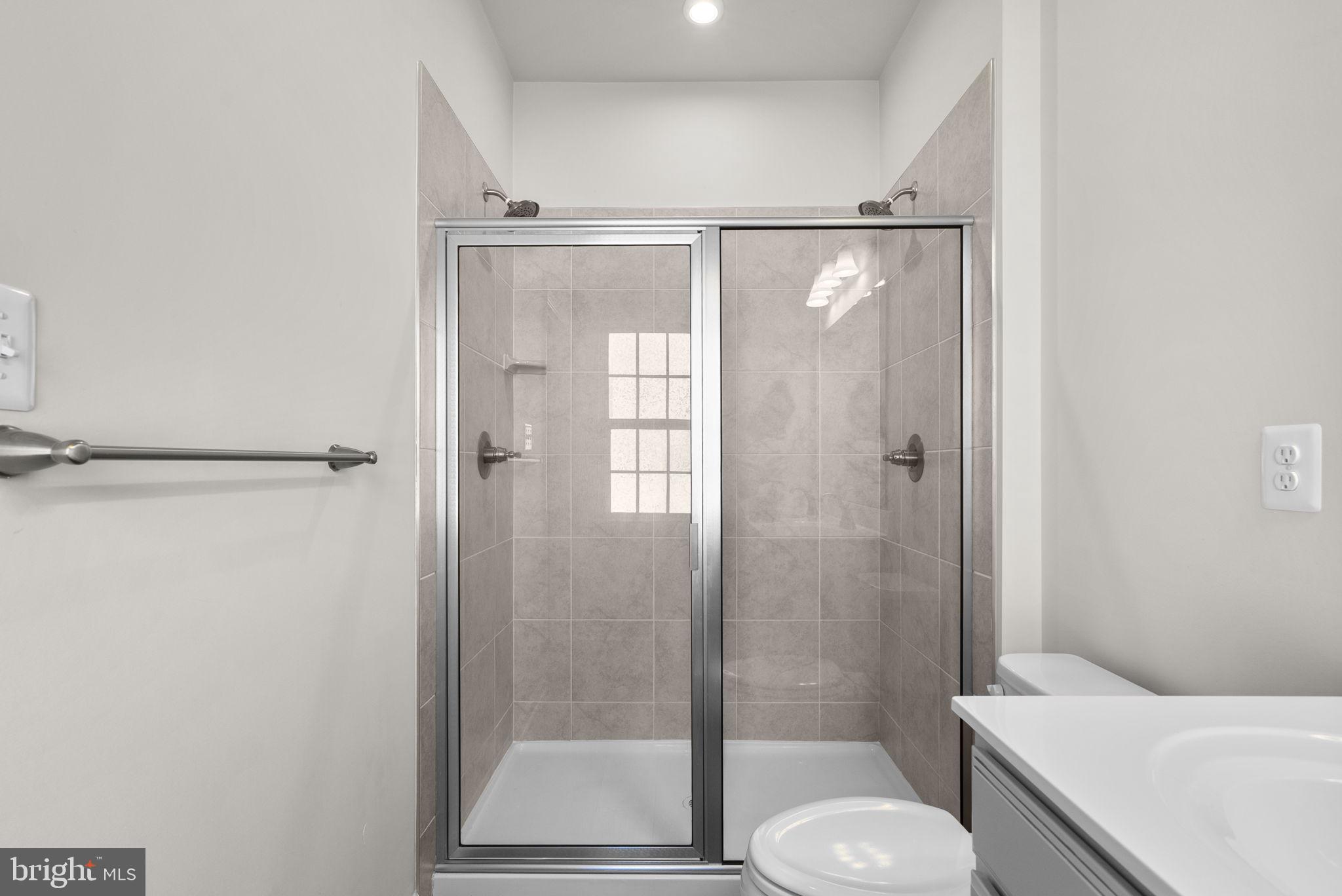 7911 Mine Run Road Hanover, MD 21076 - Photo 22 of 49 a bathroom with a shower and toilet