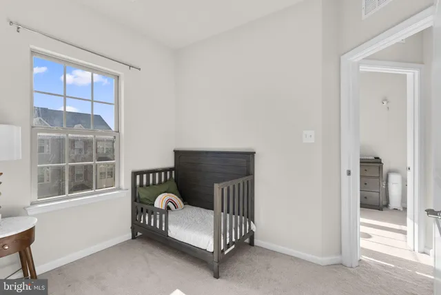 a view of a livingroom with furniture and windows