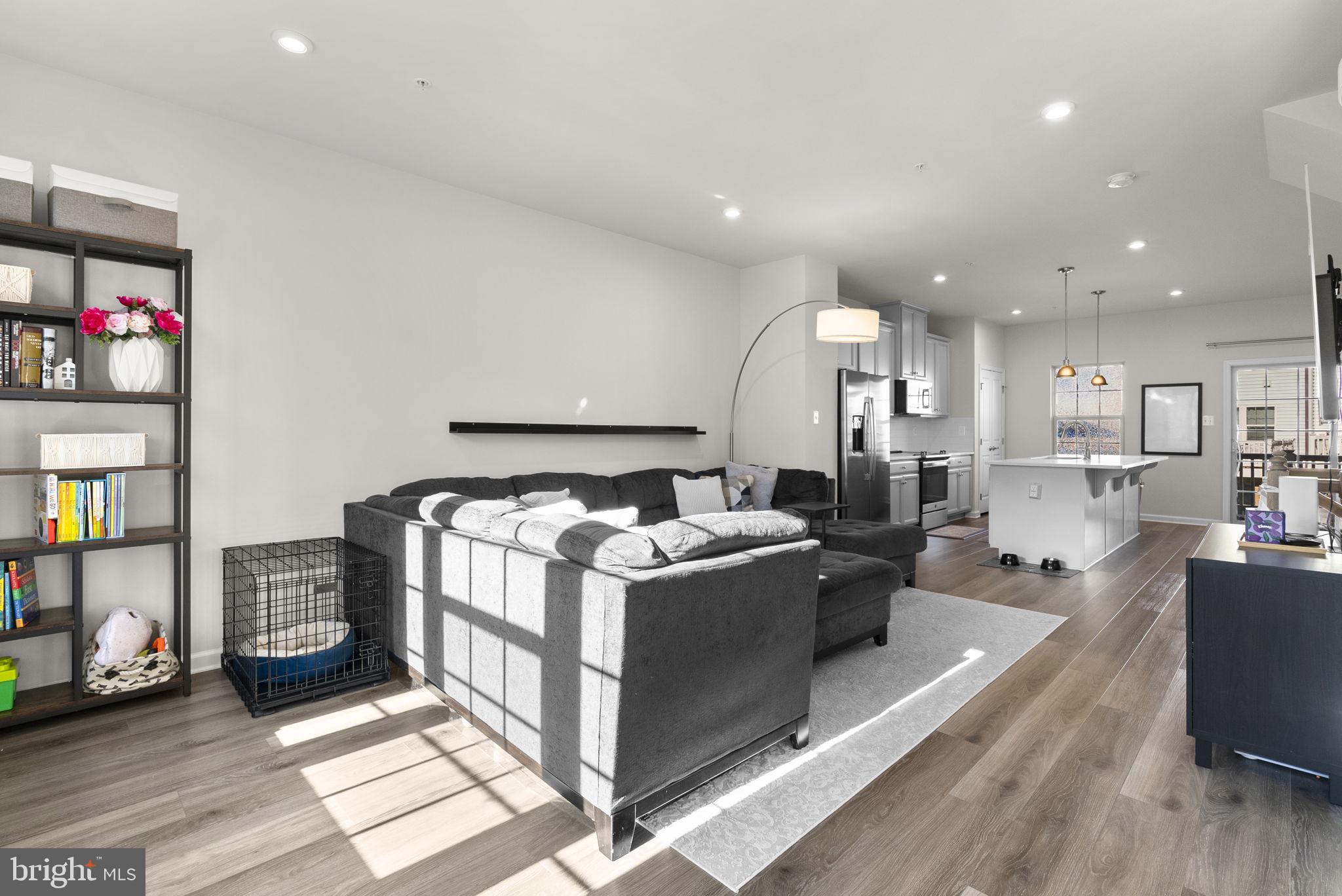 7911 Mine Run Road Hanover, MD 21076 - Photo 8 of 49 a large white kitchen with stainless steel appliances granite countertop a lot of counter top space