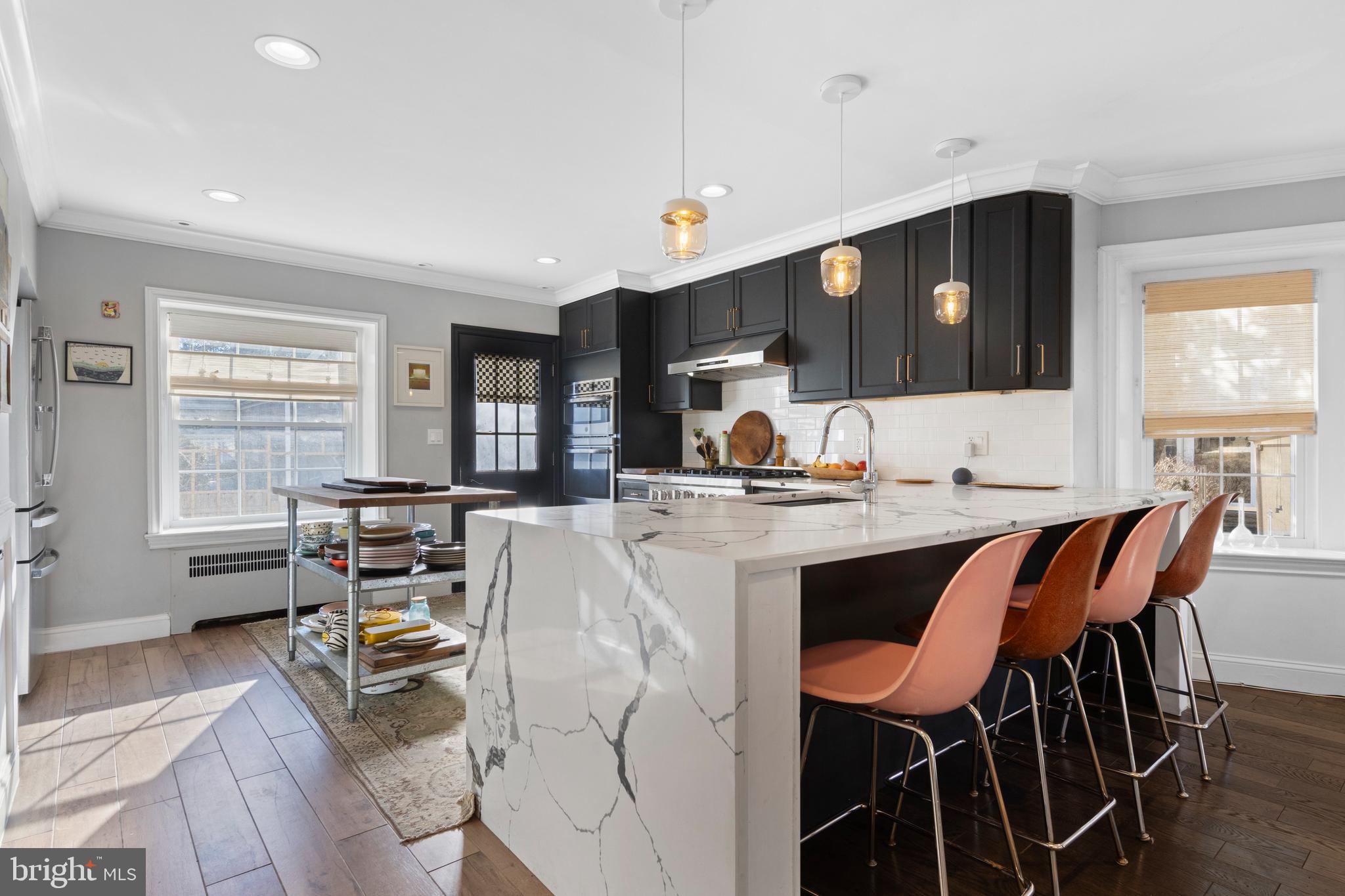 1354 Arbordale Road Wynnewood, PA 19096 - Photo 19 of 56 a living room with dining table and chairs