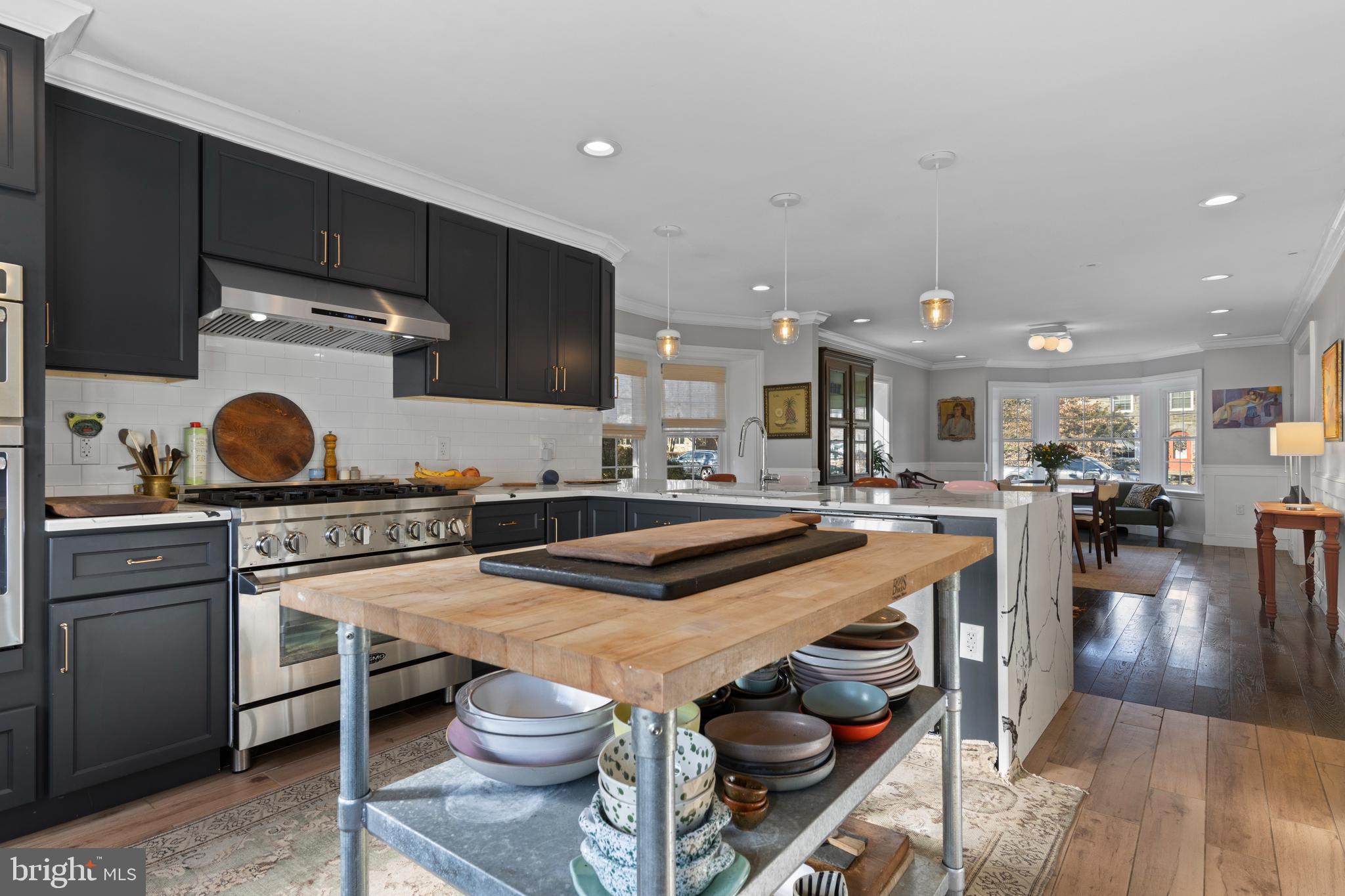 1354 Arbordale Road Wynnewood, PA 19096 - Photo 20 of 56 a kitchen with a sink a stove and chairs