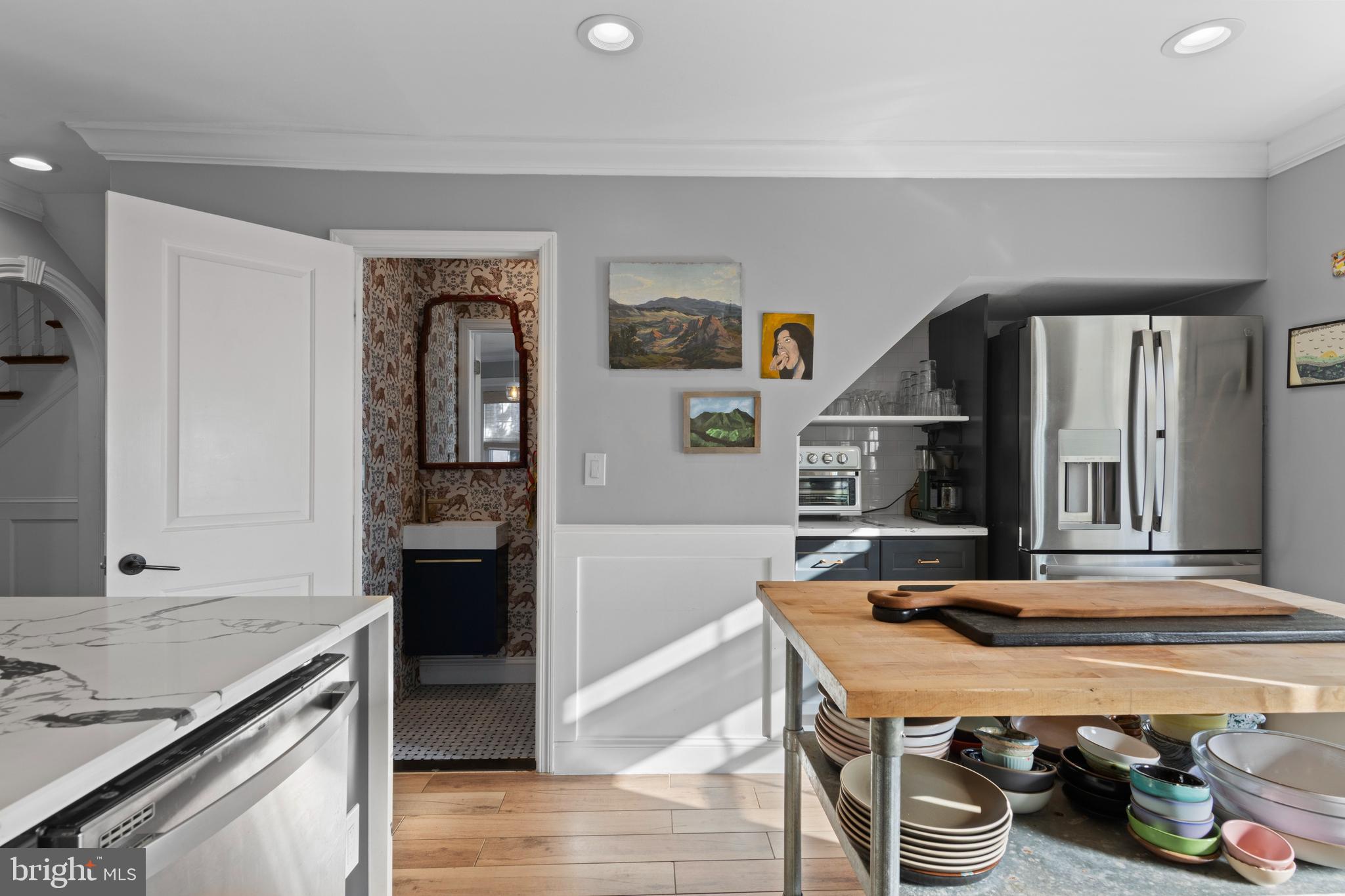 1354 Arbordale Road Wynnewood, PA 19096 - Photo 21 of 56 a dining hall with granite countertop a stove and a refrigerator