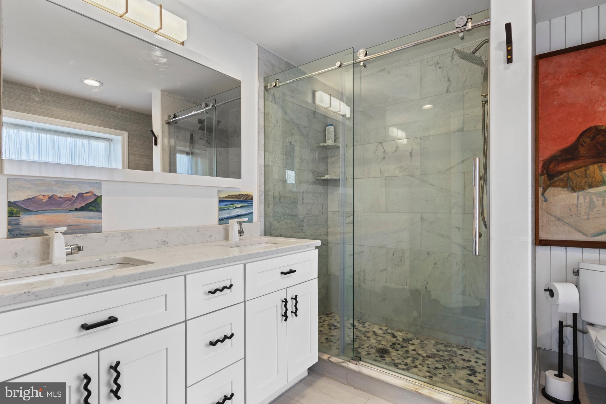 1354 Arbordale Road Wynnewood, PA 19096 - Photo 28 of 56 a bathroom with a shower sink and mirror