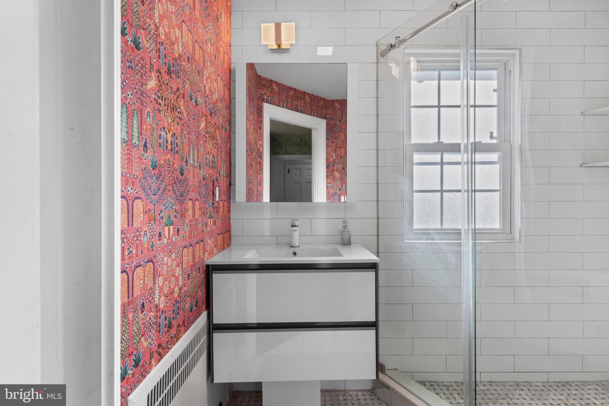 1354 Arbordale Road Wynnewood, PA 19096 - Photo 32 of 56 a bathroom with a sink and a mirror