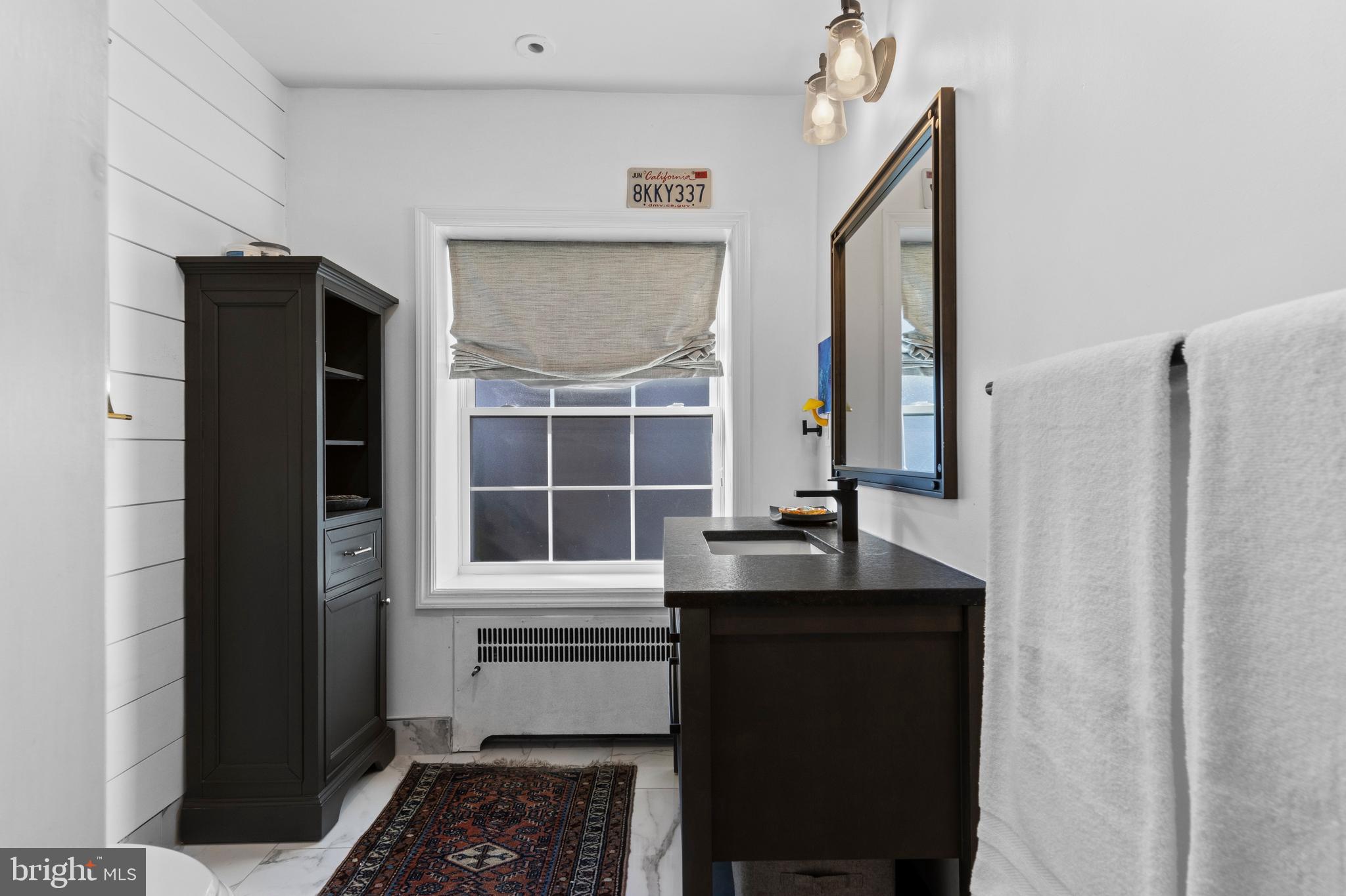 1354 Arbordale Road Wynnewood, PA 19096 - Photo 37 of 56 a kitchen with a sink and a refrigerator