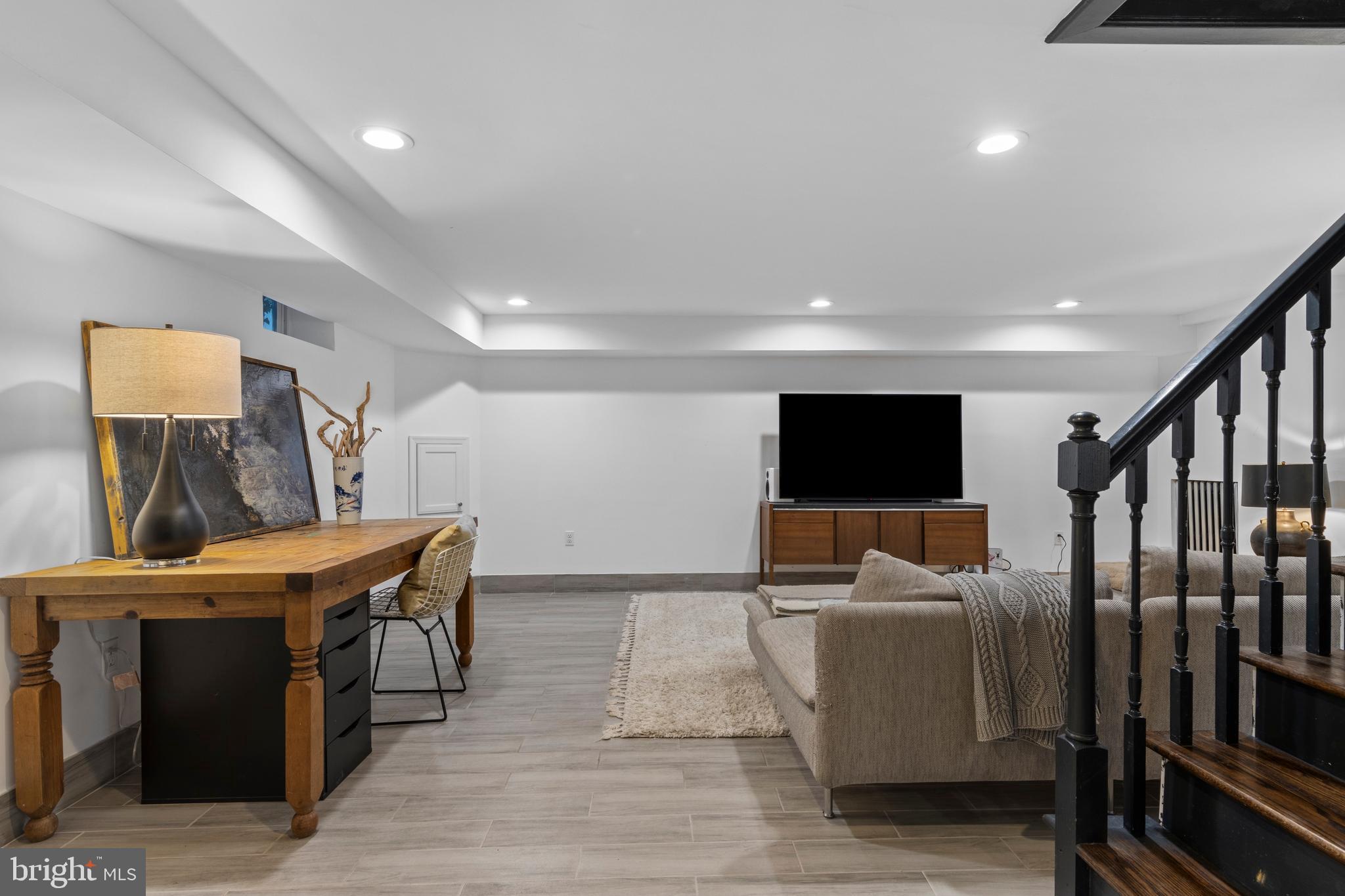 1354 Arbordale Road Wynnewood, PA 19096 - Photo 41 of 56 a living room with furniture and a flat screen tv