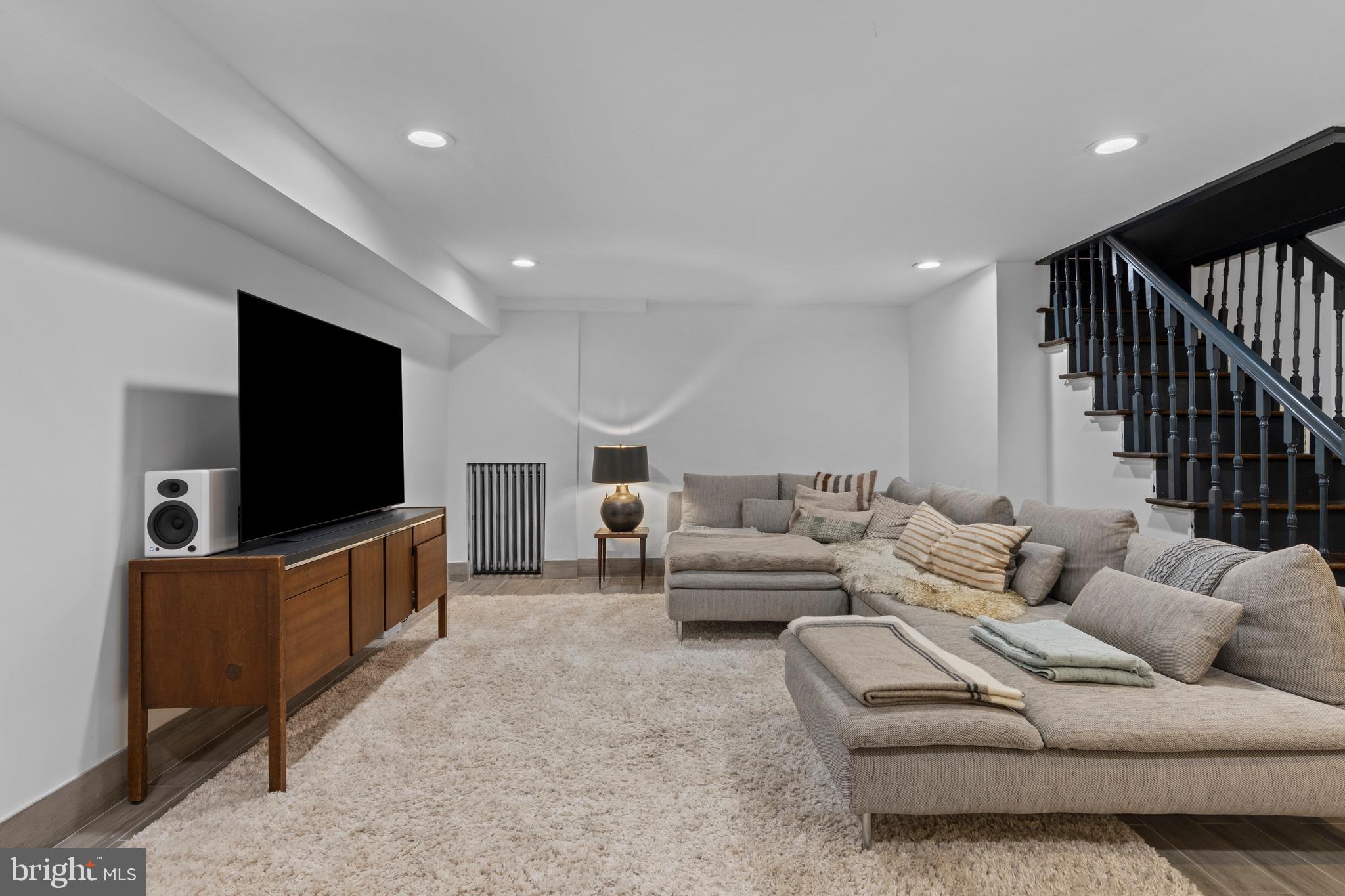 1354 Arbordale Road Wynnewood, PA 19096 - Photo 42 of 56 a living room with furniture and a flat screen tv