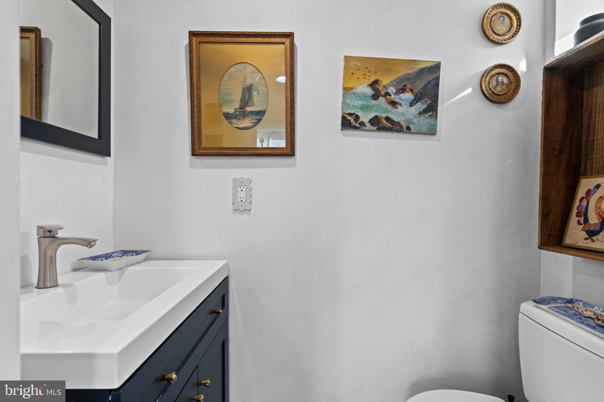 1354 Arbordale Road Wynnewood, PA 19096 - Photo 46 of 56 a bathroom with a sink and a mirror