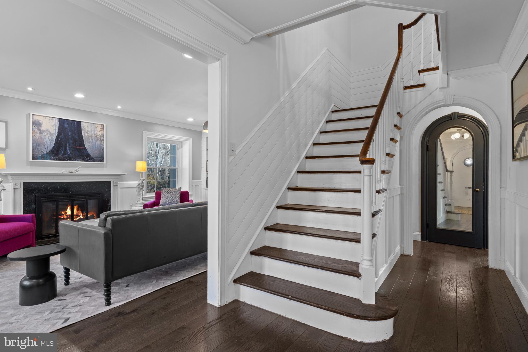 1354 Arbordale Road Wynnewood, PA 19096 - Photo 6 of 56 a living room with furniture and a fireplace