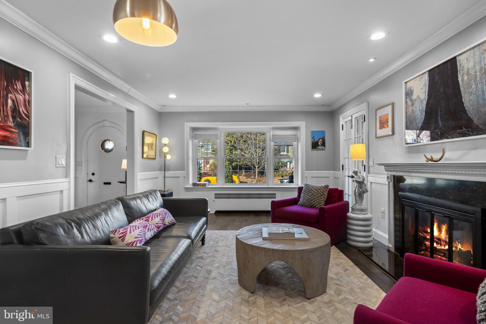 1354 Arbordale Road Wynnewood, PA 19096 - Photo 10 of 56 a living room with furniture fireplace and a large window