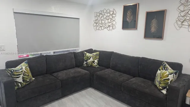 a living room with furniture and a couch