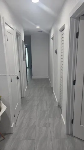 a view of a hardwood floor and dining room