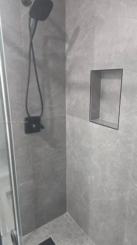 a view of an empty room with a fireplace