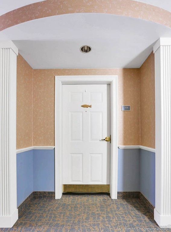 135 Beach Road, Unit 308 Salisbury, MA 01952 - Photo 3 of 15 wooden floor and closet in a room