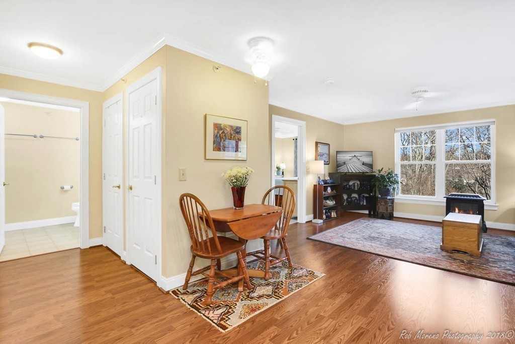 135 Beach Road, Unit 308 Salisbury, MA 01952 - Photo 7 of 15 a living room with furniture and a wooden floor