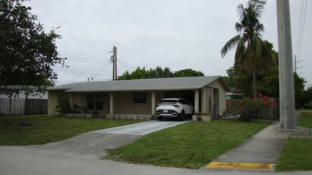 a view of a car in front of house