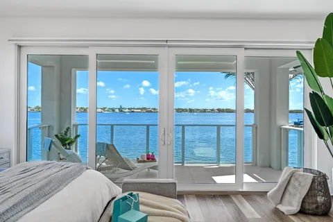 a view of a workspace with furniture and a potted plant