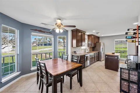 a view of a dining room with furniture window and outside view