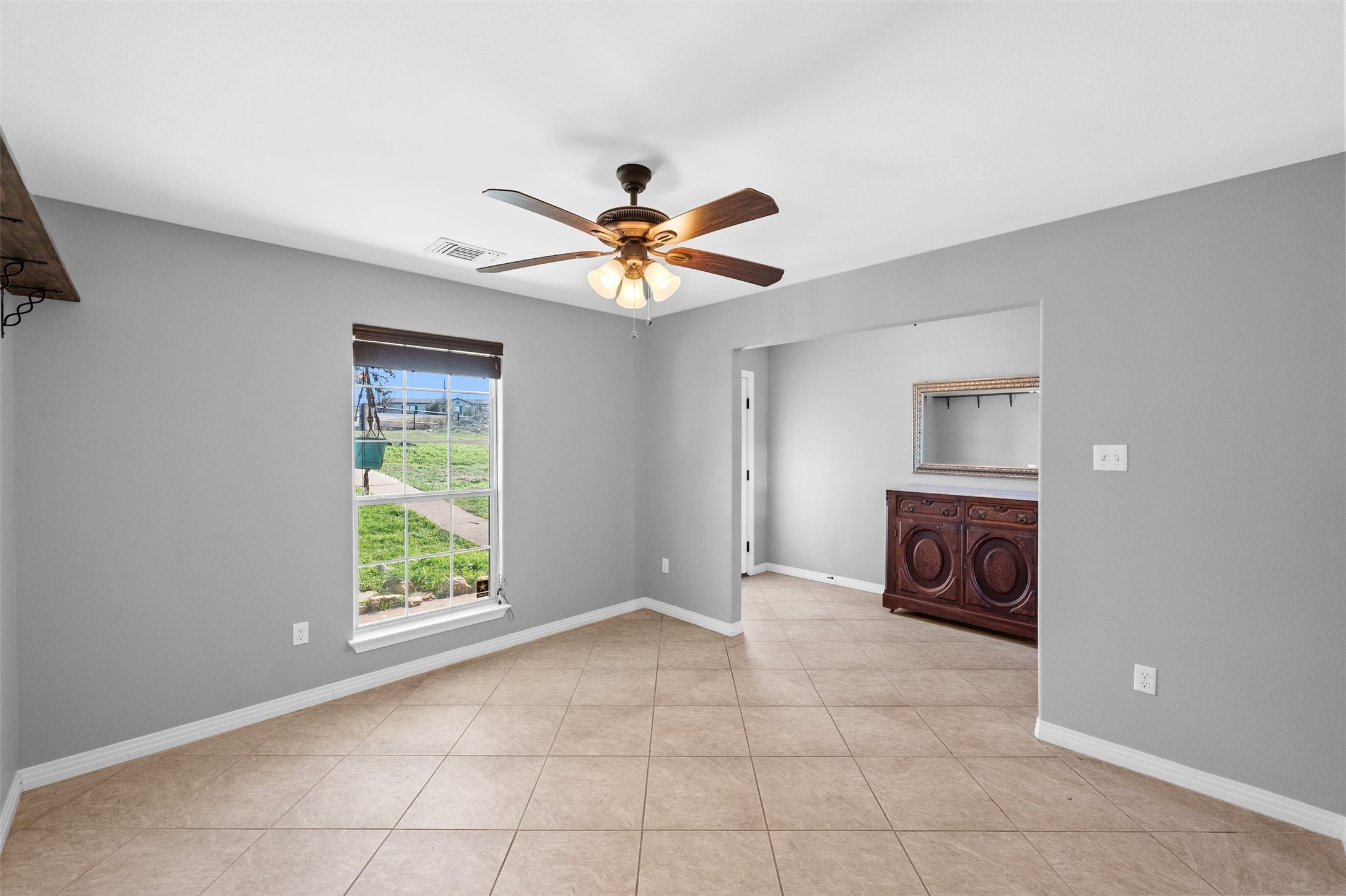 31305 Ranch Road 12 Dripping Springs, TX 78620 - Photo 20 of 32 a view of an empty room with a window and a kitchen