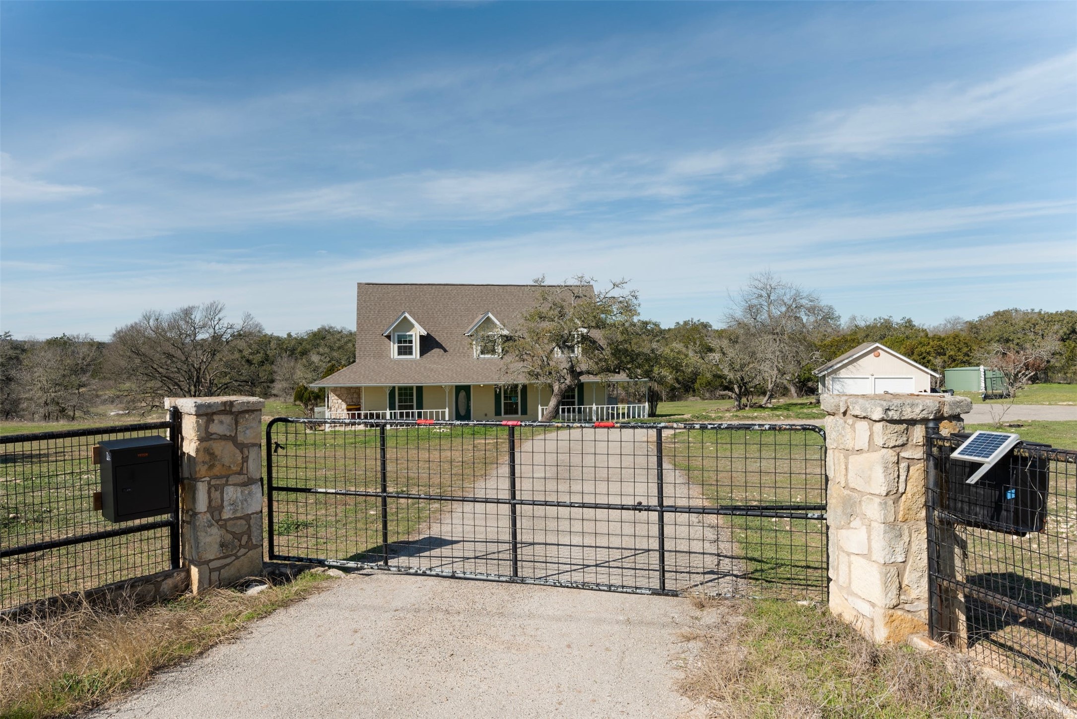 31305 Ranch Road 12 Dripping Springs, TX 78620 - Photo 4 of 32 a view of a houses with a balcony