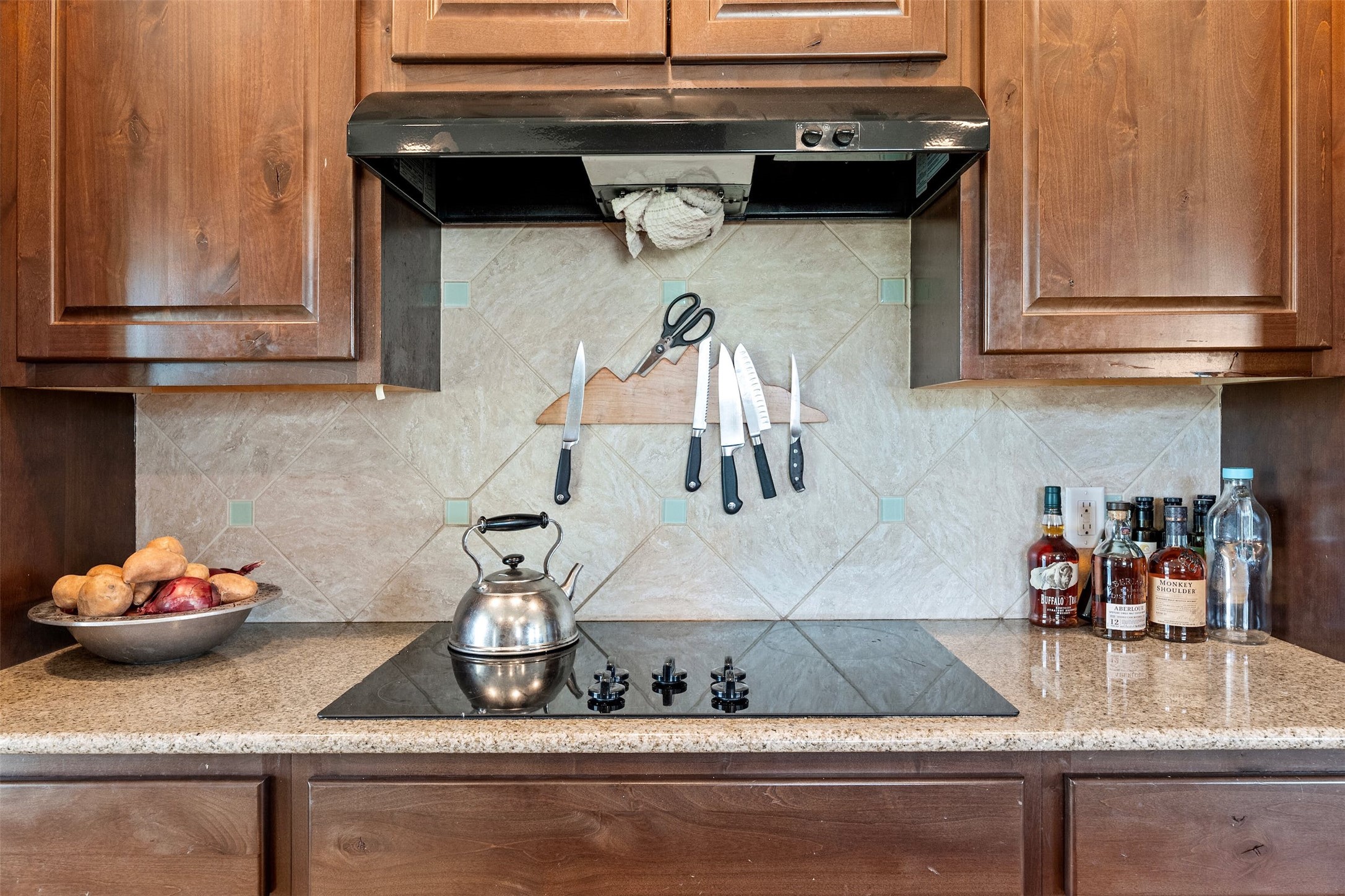 31305 Ranch Road 12 Dripping Springs, TX 78620 - Photo 10 of 32 a kitchen with a sink and cabinets
