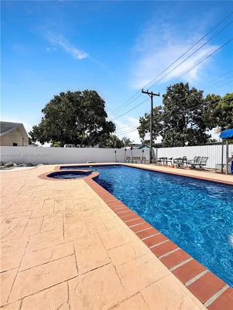 a view of swimming pool with lounge chair