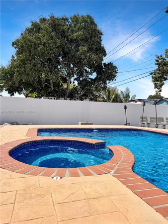 a view of swimming pool with lounge chair