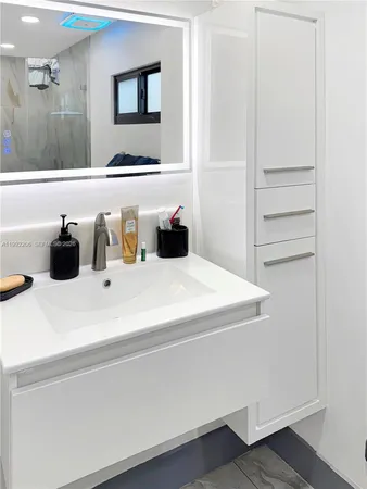 a view of a living room and bathroom